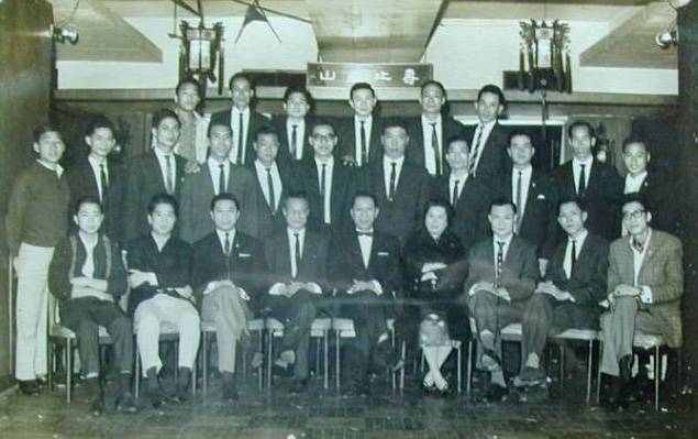 Grandmaster Lam Cho is sitting in the center